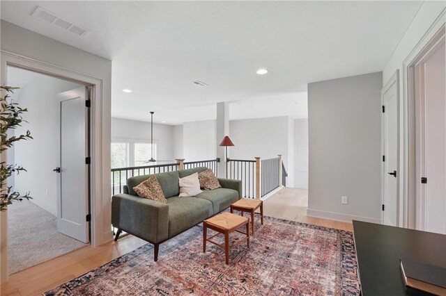 1506 NW 106th Ter, Kansas City, MO 64155 - living area featuring visible vents, recessed lighting, baseboards, and light wood-type flooring