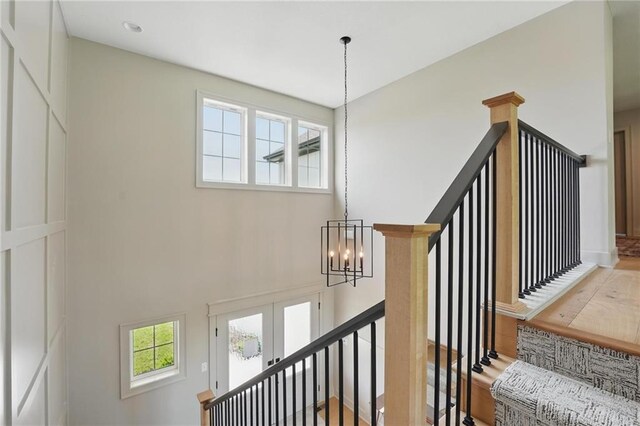 1506 NW 106th Ter, Kansas City, MO 64155 - stairway with a towering ceiling and a notable chandelier