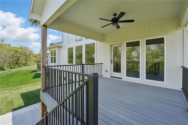 1506 NW 106th Ter, Kansas City, MO 64155 - wooden deck with a lawn and ceiling fan