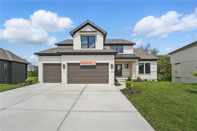 1506 NW 106th Ter, Kansas City, MO 64155 - view of front of home featuring a garage, a front lawn, stone siding, board and batten siding, and concrete driveway