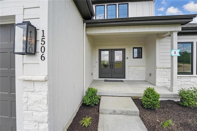 1506 NW 106th Ter, Kansas City, MO 64155 - property entrance featuring french doors and stone siding