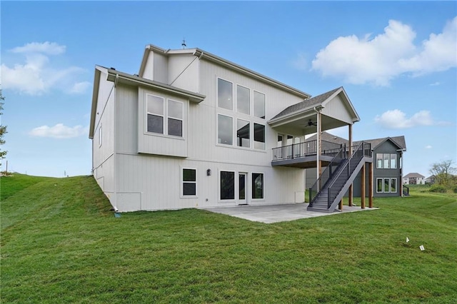 1506 NW 106th Ter, Kansas City, MO 64155 - rear view of property with a deck, a patio, a ceiling fan, a lawn, and stairway