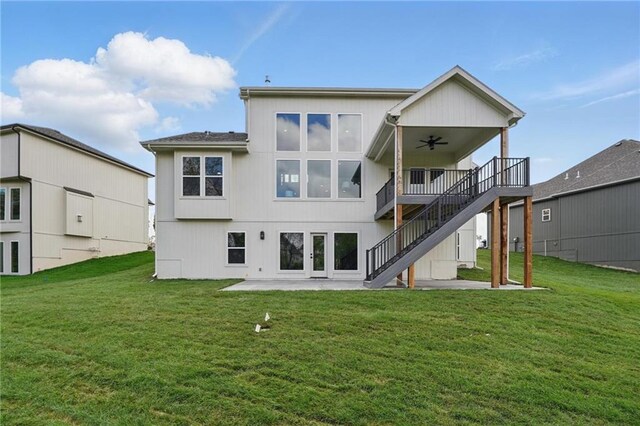 1506 NW 106th Ter, Kansas City, MO 64155 - back of property with a ceiling fan, a patio, a yard, and stairway