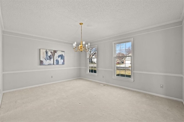 carpeted spare room featuring baseboards, a textured ceiling, a chandelier, and crown molding