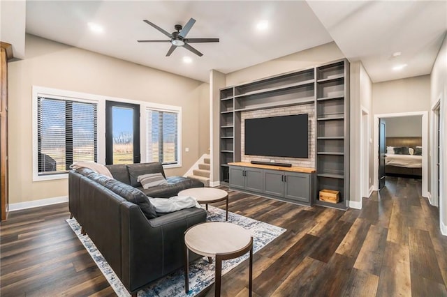 living room featuring ceiling fan, dark wood-style flooring, built in features, and baseboards