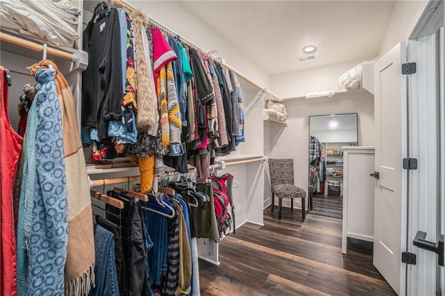 walk in closet with wood finished floors and visible vents