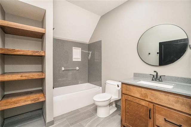 bathroom featuring toilet, bathing tub / shower combination, lofted ceiling, and vanity