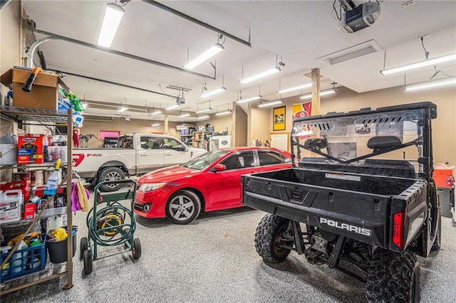 garage featuring a garage door opener