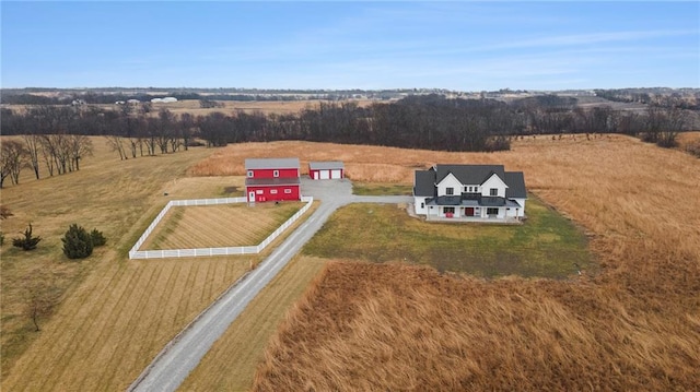 birds eye view of property with a rural view