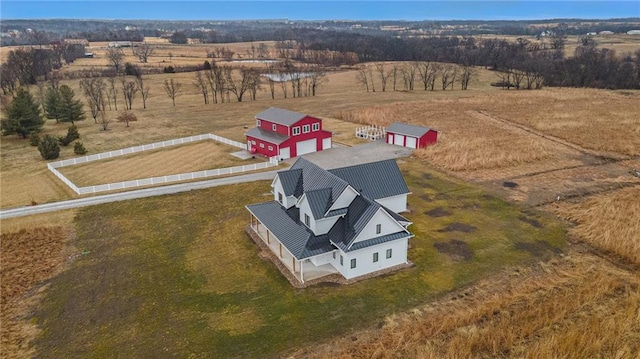 birds eye view of property featuring a rural view