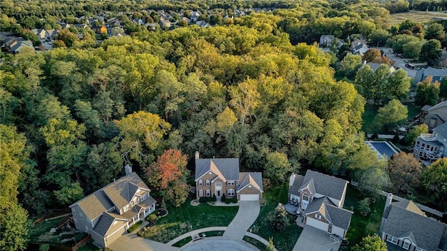 bird's eye view with a forest view and a residential view