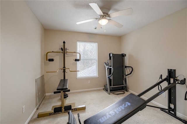 workout room featuring baseboards, carpet, and ceiling fan