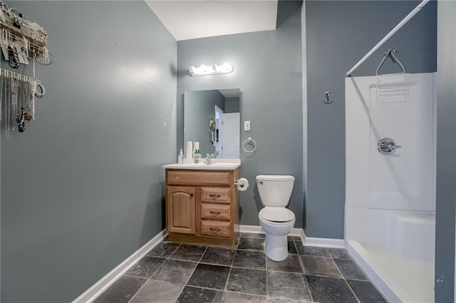 full bath featuring baseboards, toilet, and walk in shower