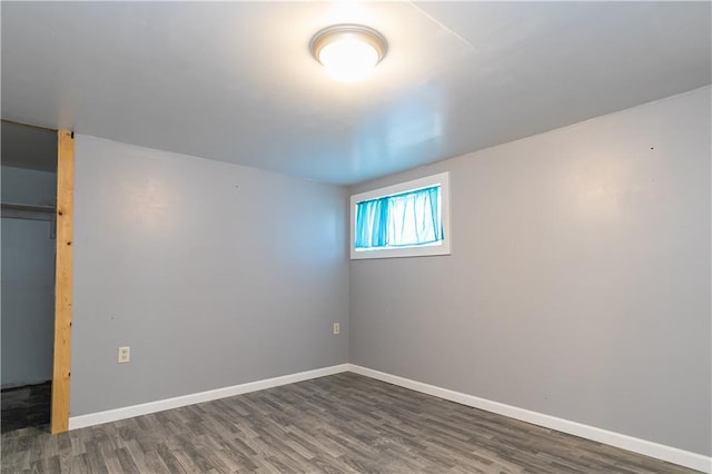 unfurnished bedroom with wood finished floors and baseboards