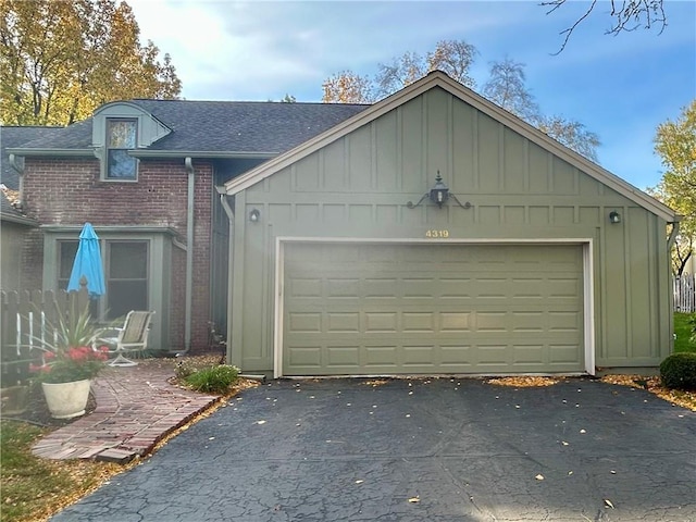 garage with aphalt driveway