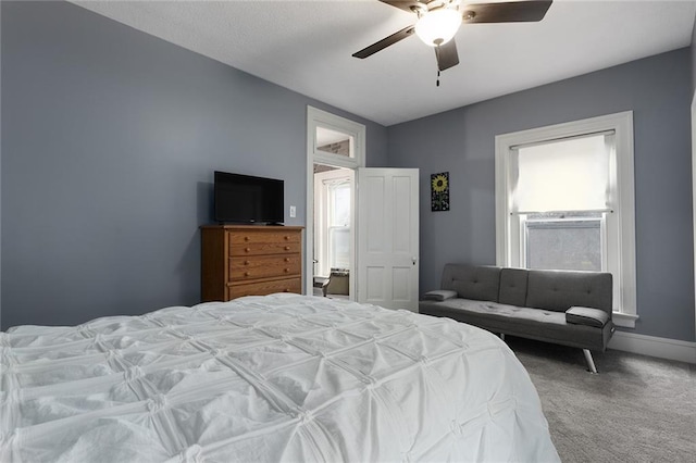 bedroom featuring carpet, baseboards, and ceiling fan