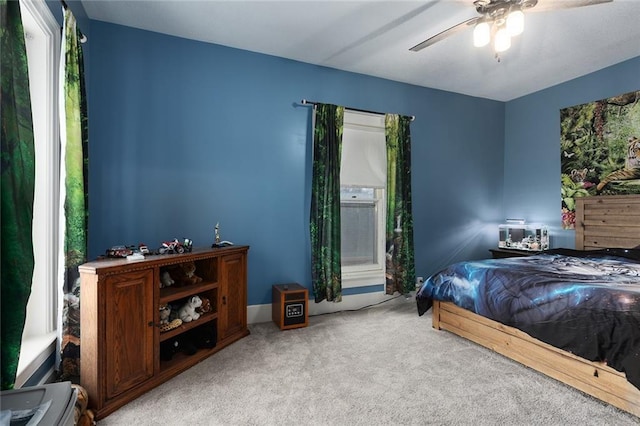 carpeted bedroom with a ceiling fan