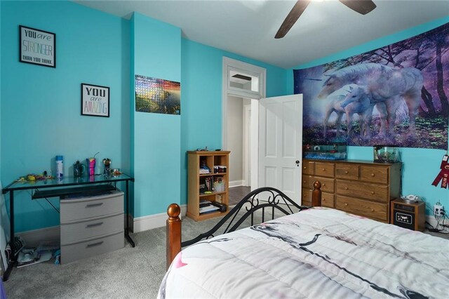 bedroom featuring carpet floors, baseboards, and a ceiling fan