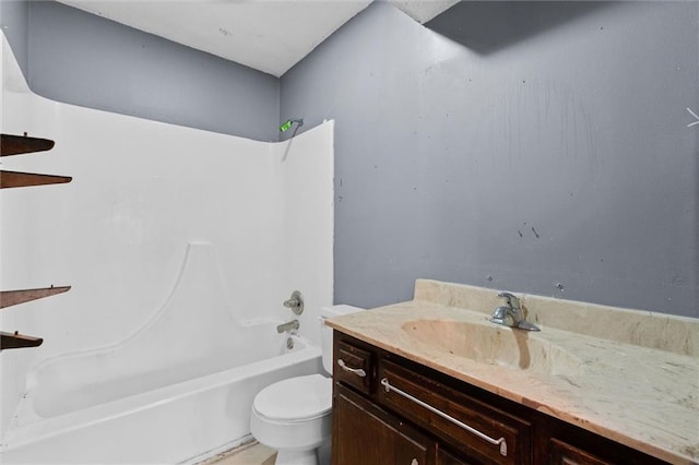 bathroom featuring toilet, washtub / shower combination, and vanity