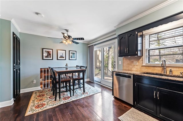 dining area featuring baseboards, a ceiling fan, dark wood-style floors, and crown molding