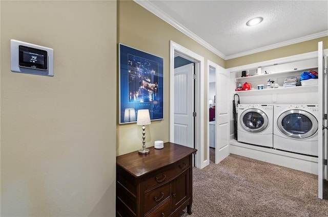 clothes washing area with carpet, laundry area, a textured ceiling, crown molding, and independent washer and dryer