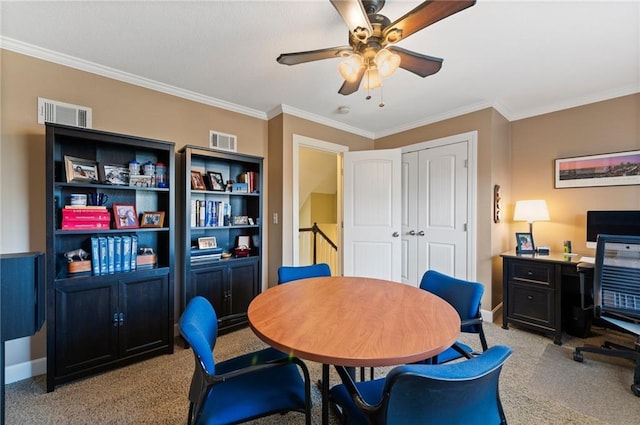 office area with visible vents, light colored carpet, and ornamental molding