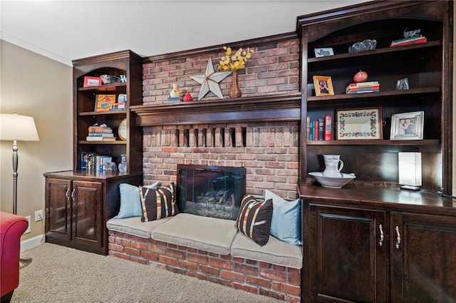 living room with baseboards, carpet floors, ornamental molding, and a fireplace