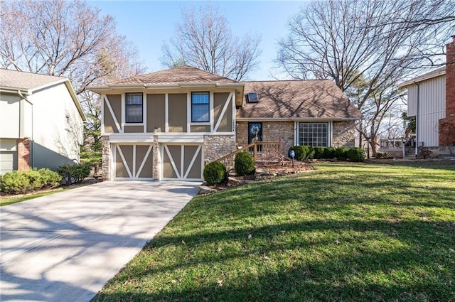 view of front of property with stucco siding, driveway, stone siding, a front yard, and a garage