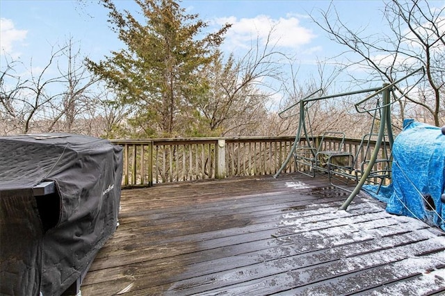 wooden terrace featuring area for grilling