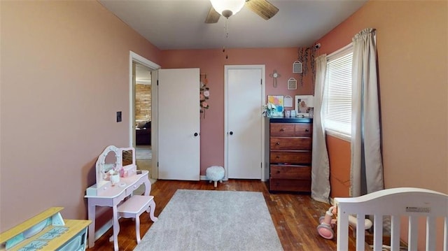 bedroom with a ceiling fan and wood finished floors