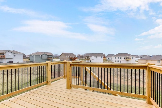 wooden terrace with a residential view