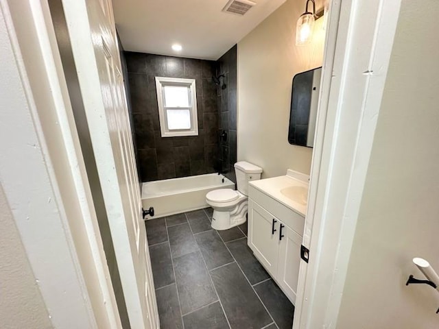 full bathroom featuring bathtub / shower combination, toilet, vanity, visible vents, and tile patterned floors