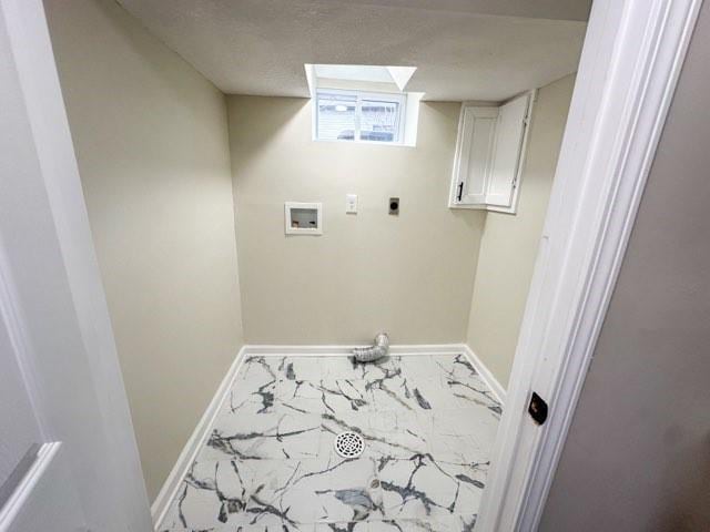 clothes washing area featuring marble finish floor, hookup for a washing machine, electric dryer hookup, and baseboards