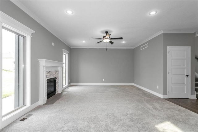 unfurnished living room with baseboards, visible vents, a fireplace, and carpet flooring