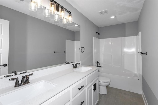 full bath featuring toilet, visible vents, shower / washtub combination, and a sink