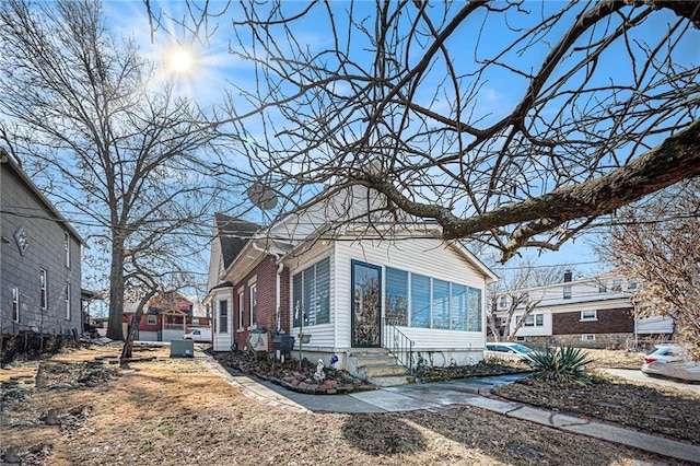 view of property exterior featuring entry steps
