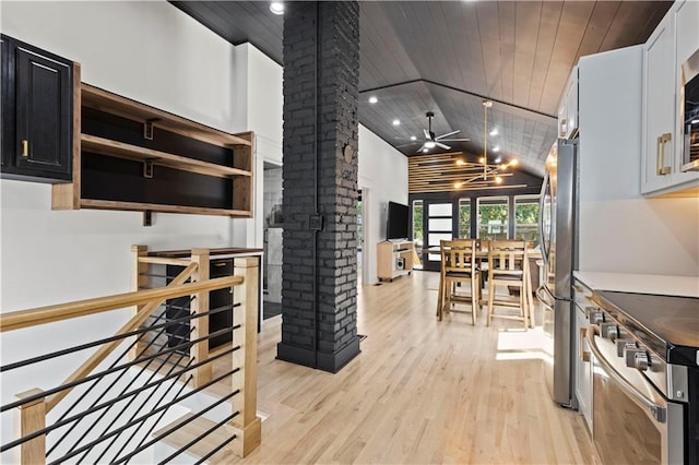 kitchen featuring stainless steel appliances, lofted ceiling, light wood-style floors, wood ceiling, and ornate columns