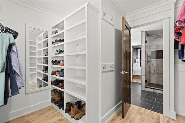 spacious closet with light wood finished floors