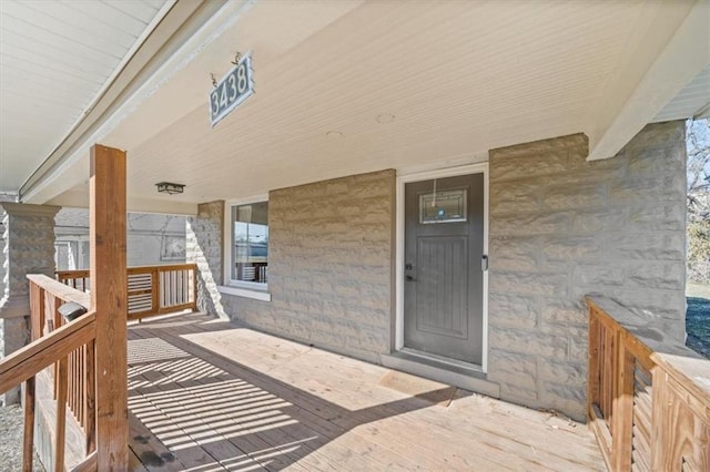 doorway to property featuring covered porch