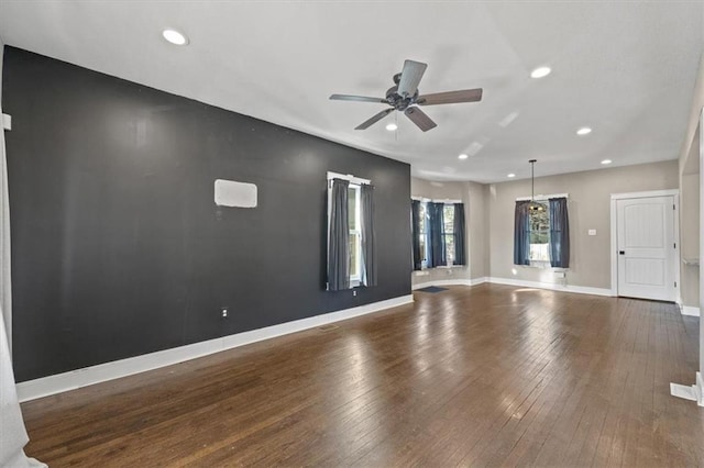 unfurnished living room with recessed lighting, baseboards, wood-type flooring, and ceiling fan