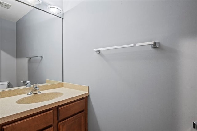 half bath with visible vents and vanity