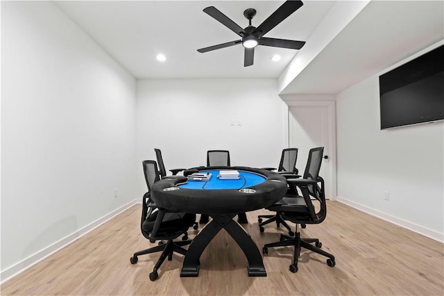 office space featuring baseboards, recessed lighting, a ceiling fan, and light wood-style floors