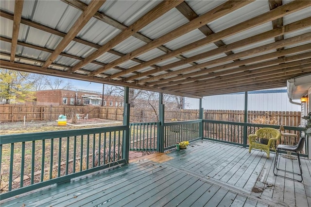 wooden terrace featuring a fenced backyard