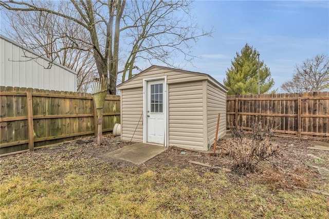 view of shed with a fenced backyard