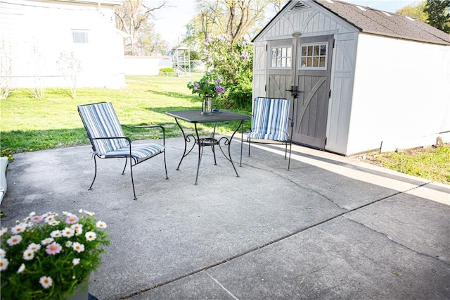 view of patio with an outdoor structure and a shed