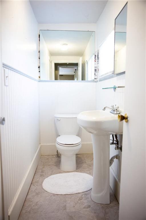 half bath featuring toilet