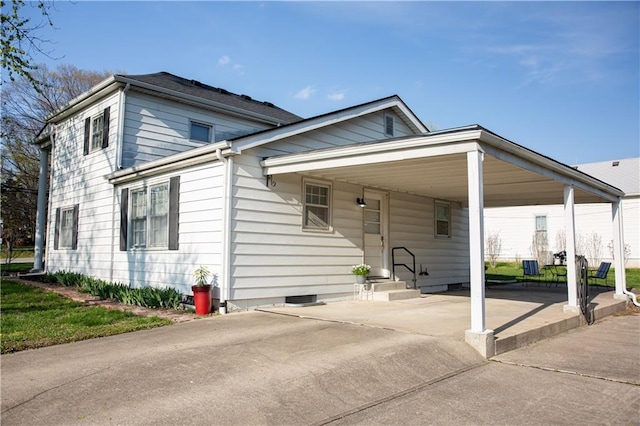 view of front of property with an attached carport