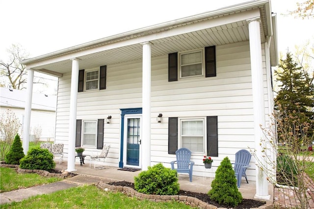 neoclassical / greek revival house with covered porch