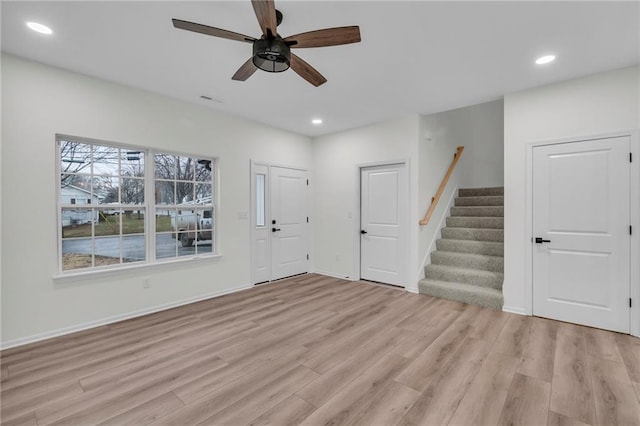 entryway with recessed lighting, light wood-type flooring, ceiling fan, and stairs