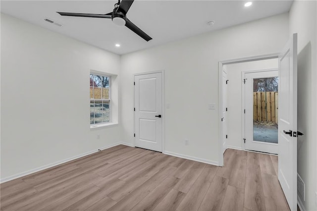 unfurnished bedroom with a ceiling fan, visible vents, baseboards, recessed lighting, and light wood-type flooring